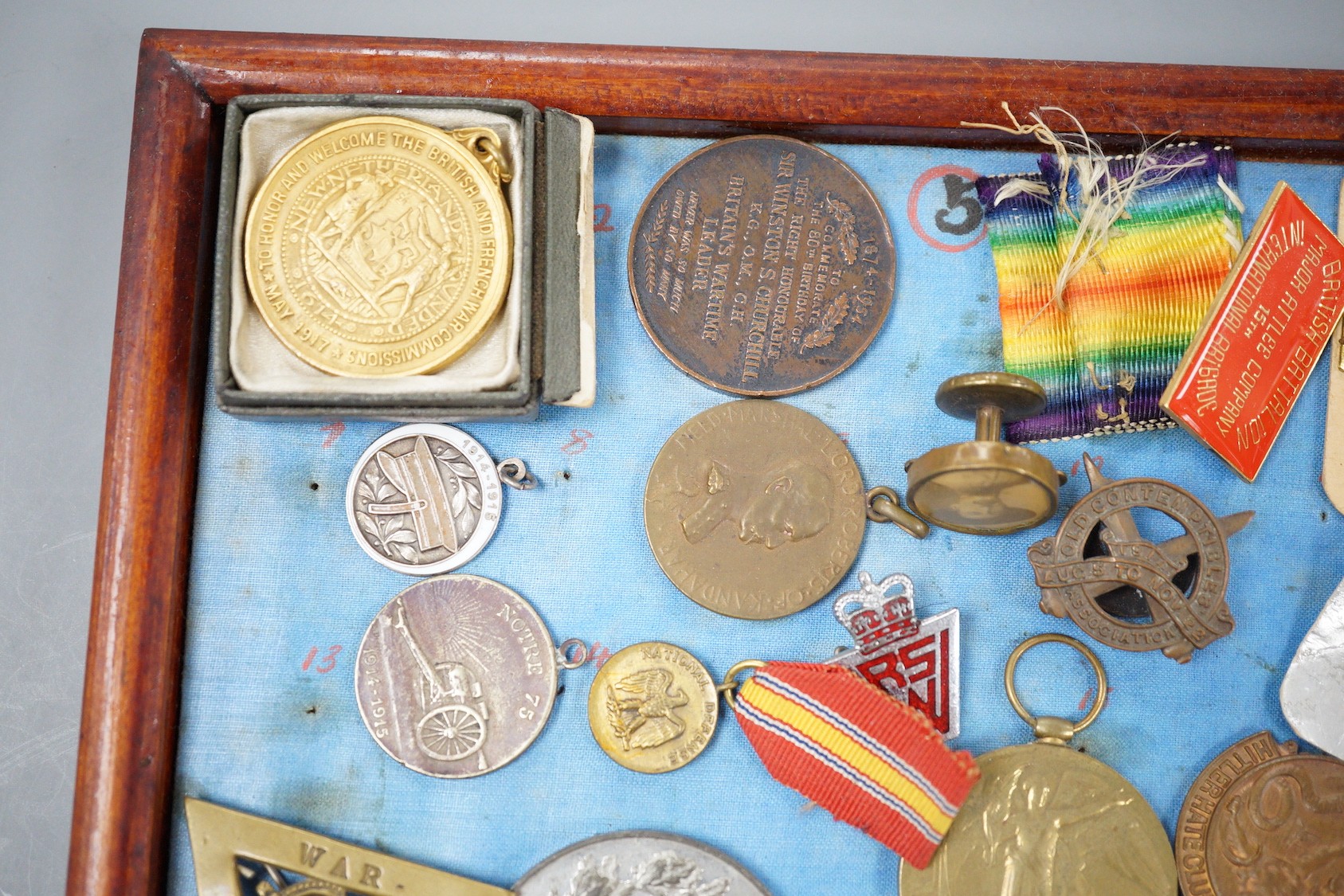 A group of WWI and WW2 and other military medals, badges and ephemera